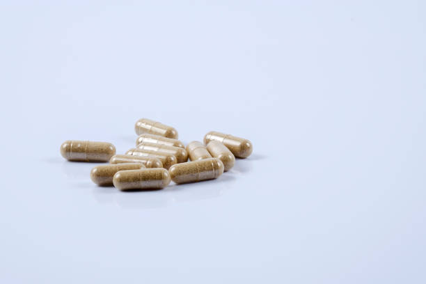 istock Close-Up Of Capsules On Blue Background 1134683731