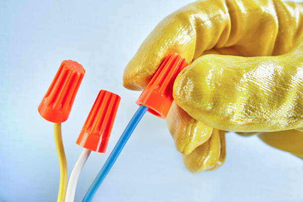 istock Twist-on wire connectors in worker's hands. 1134684256