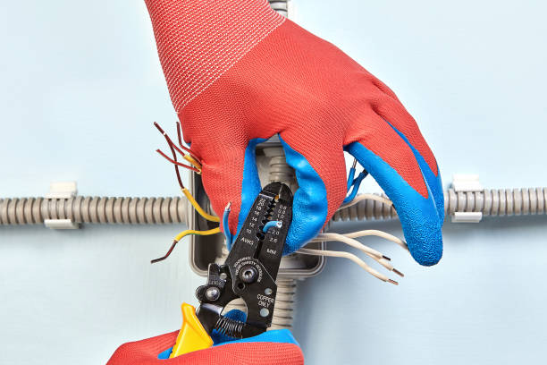 istock Electrician cuts copper wiring with crimper tool. 1134684282