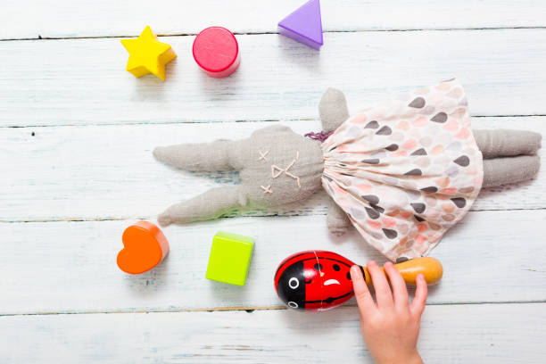 istock Baby hand and toys 1134687601