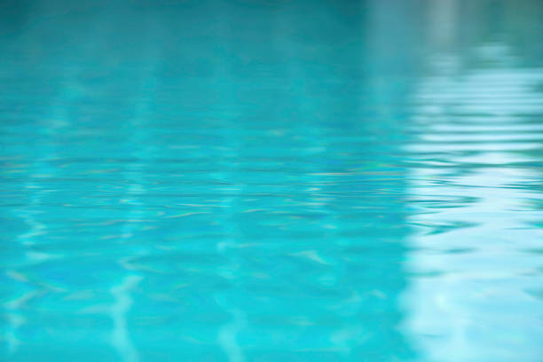 istock The blue water waves by wind and sunlight reflecting surface In the swimming pool. 1134690533