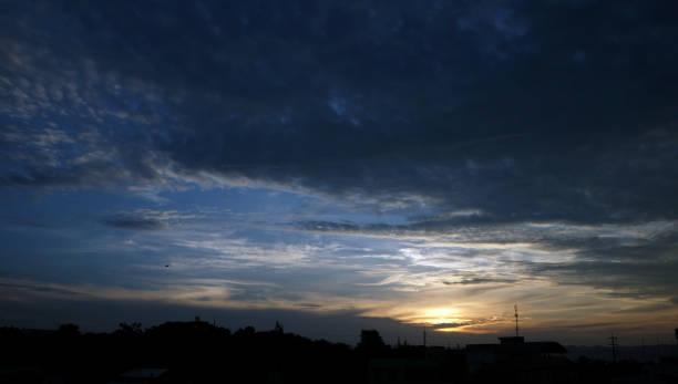istock Sunset sky background with clouds and sun, photo image wallpaper. 1134691100
