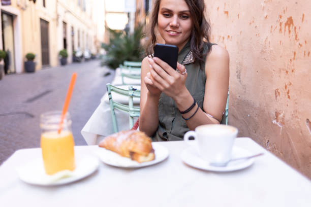 istock Young woman resting and having breakfast outdoors 1134691174