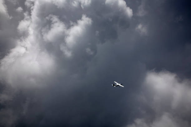 istock An airplane flying through the storm cloud in the sky. 1134692353