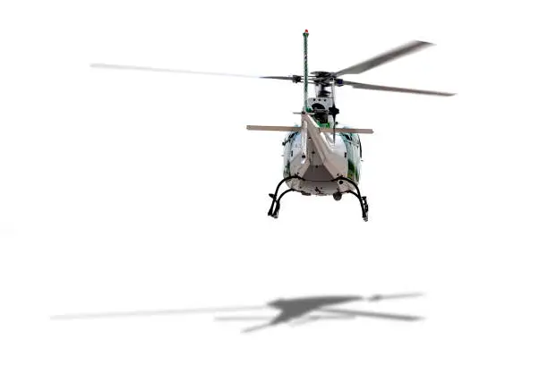 Photo of White helicopter hopping in position on white background