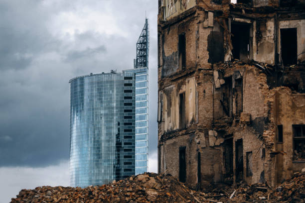 A new modern glass skyscraper and a destroyed old building