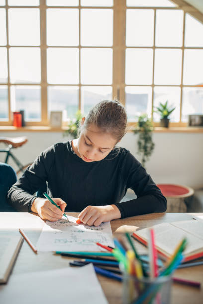 istock Girl studying alone at home 1134694547