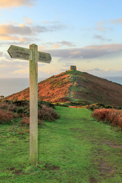 Footpath with Signage, leading to Ruined Chapel on the Rame Head Peninsula, South East Cornwall Footpath with Signage, leading to Ruined Chapel on the Rame Head Peninsula, South East Cornwall, UK rame stock pictures, royalty-free photos & images