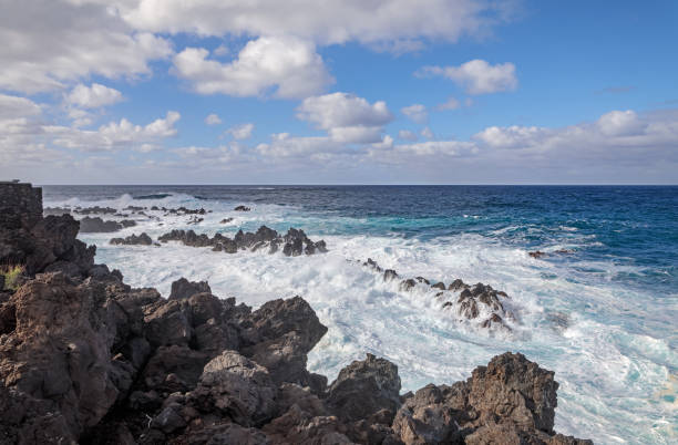 istock Breaking waves at a rocky coast 1134696815