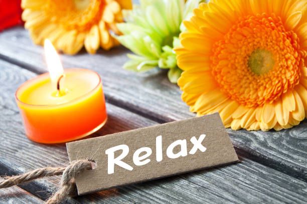 Relax label, flowers and candle background