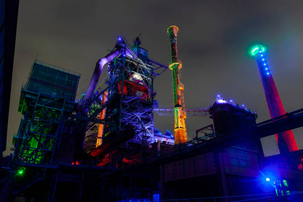 istock Old factory buildings illuminated at night 1134698227