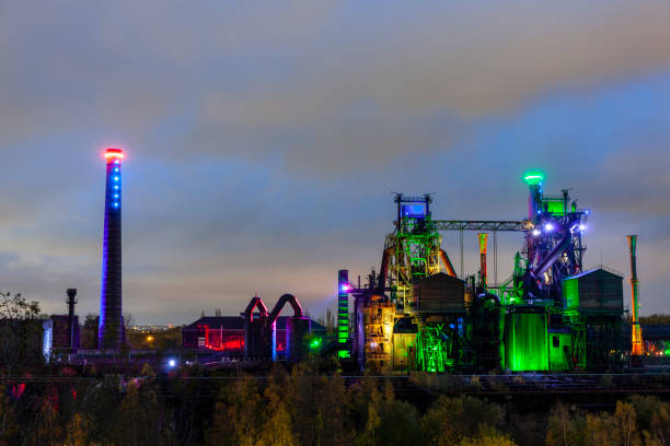 istock Old factory buildings illuminated at night 1134698244