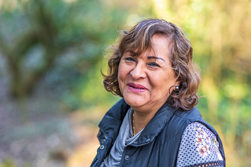 Senior Hispanic woman portrait in Welsh countryside