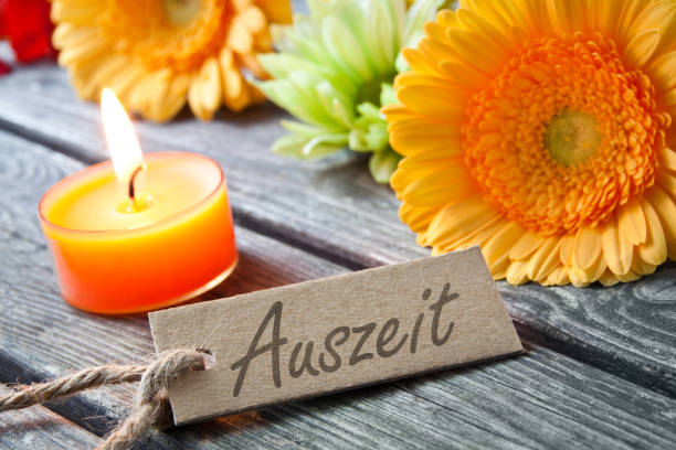 German time out label and decoration with candle German time out label flowers and candle background time out signal stock pictures, royalty-free photos & images