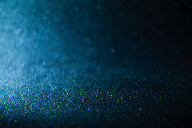 istock Bokeh defocused glittering lights blurred abstract blue black dark background 1134700702