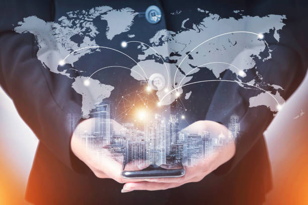 istock Hand holding smartphone with worldwide network connection technology icon. Network connection concept. Global network business concept. World map element of this image furnished by NASA. 1134702974