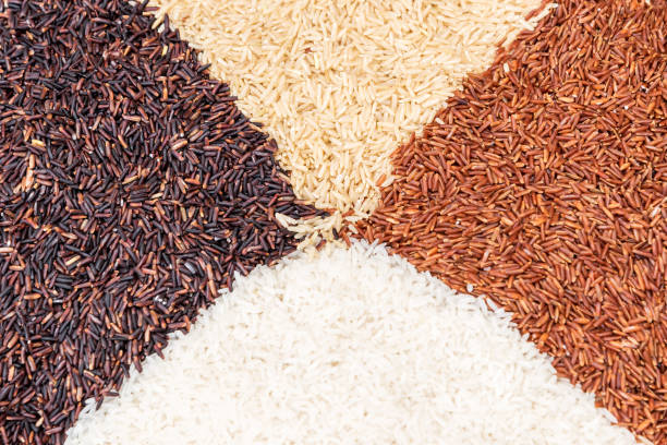 istock Thai rice varieties of brown rice mixed on table. Rice background. 1134703484