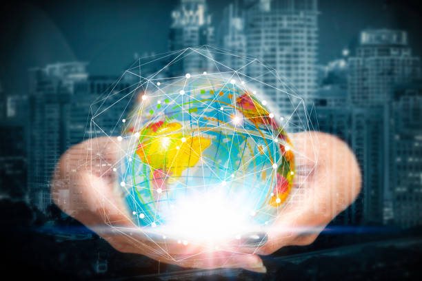 istock Hand holding abstract illuminated globe and connection lines symbol with blurred business city center background. Worldwide business and global network technologies concept. 1134703503