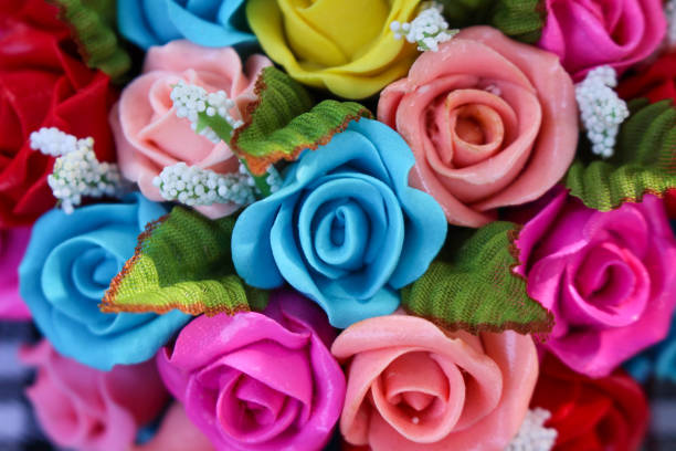Ornamental colorful flowers miniature clay roses texture ,  nature patterns for background