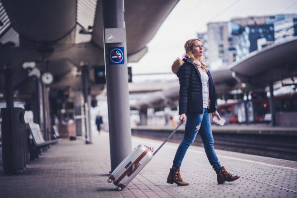 Young woman going in train.