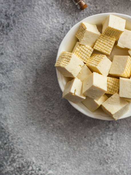 istock tofu (soy cheese) asian cuisine. copy space. food background. top 1134706017