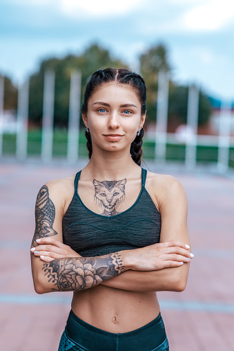 Portrait Young Sporty Beautiful Girl In Cat Tattoos In Morning Before  Fitness Training Sportswear Top Summer In City Workout Emotions Of  Confidence Courage Strength And Endurance Happy Smiles Stock Photo -  Download