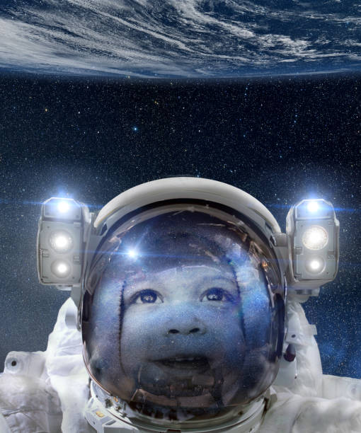 istock Child astronaut looking at Earth from space 1134707293