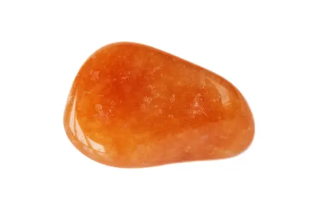 Natural semi-precious bright orange carnelian stone isolated on white background