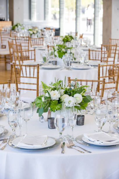 istock wedding table set for fine dining at a fancy catered event - wedding table series 1134707734