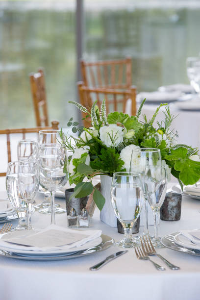 istock wedding table set for fine dining at a fancy catered event - wedding table series 1134707758