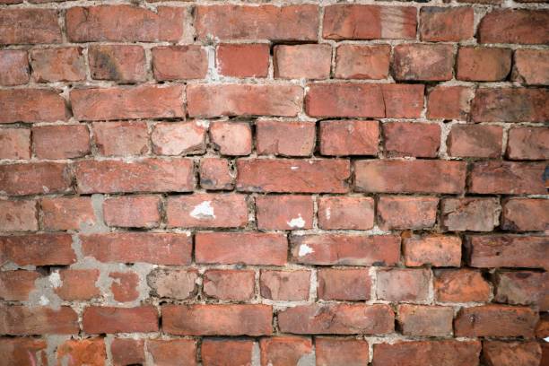istock Dilapidated old brick wall as the basis of the background. 1134711003