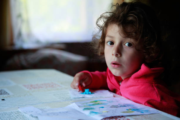 Frightened little girl looking at camera