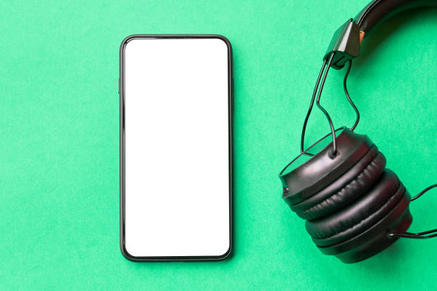 istock Headphones and smartphone on colorful background. 1134712453