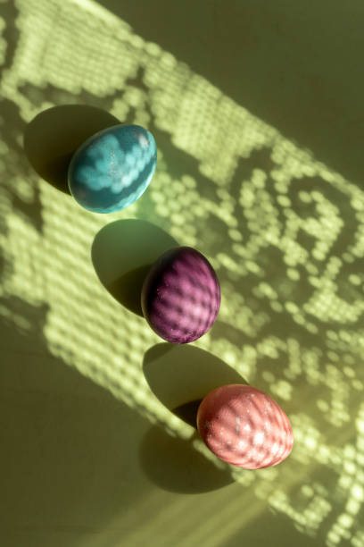 istock Three Colorful egg easter, painted with natural dyes on green background 1134712575