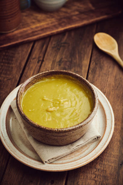 istock Rustic bow of Pea and Ham Soup against a dark aged wood tabletop. 1134714015