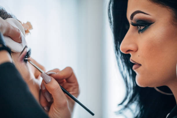 istock Makeup artist applying makeup on a fashion model 1134715610