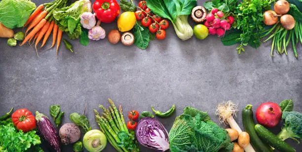 Photo of Healthy food concept with fresh vegetables and ingredients for cooking