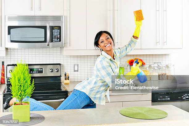 Young Woman Cleaning Kitchen Stock Photo - Download Image Now - Adult, Adults Only, African Ethnicity