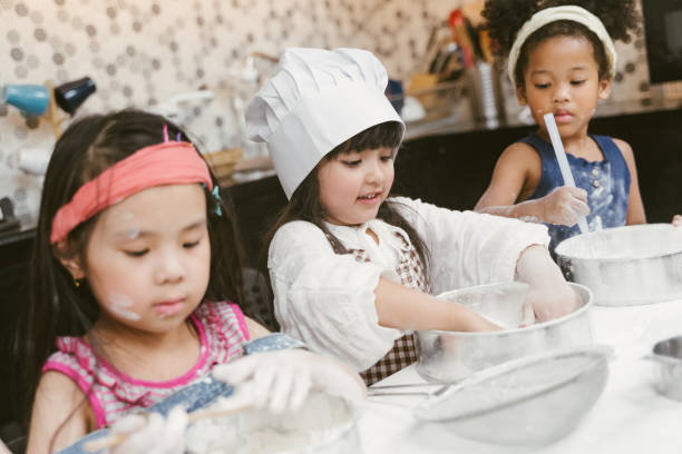 istock Children learning to cooking cookies 1134721314