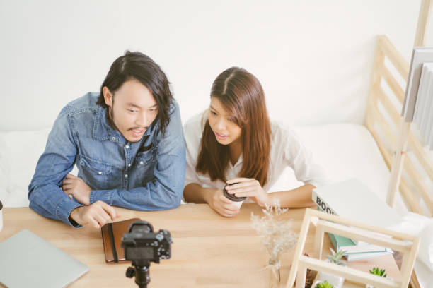 istock couple blogger with recording video 1134721569