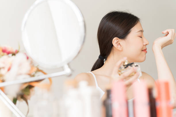 istock Asian girl with perfume 1134721807