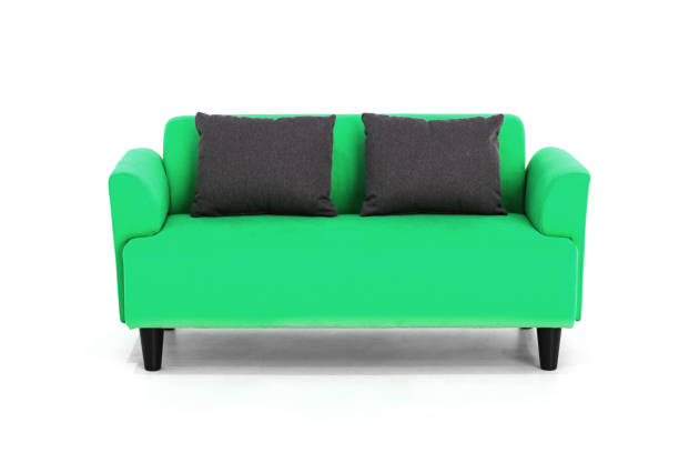 istock Green Scandinavian style contemporary sofa on white background with modern and minimal furniture design for stylish living room. 1134726544