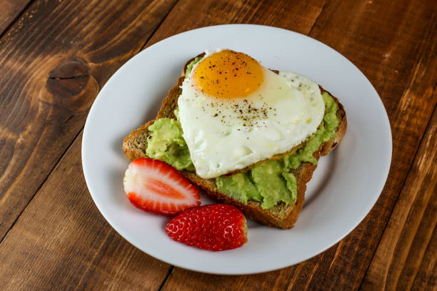istock Toast with avocado and egg in heart shape 1134728056