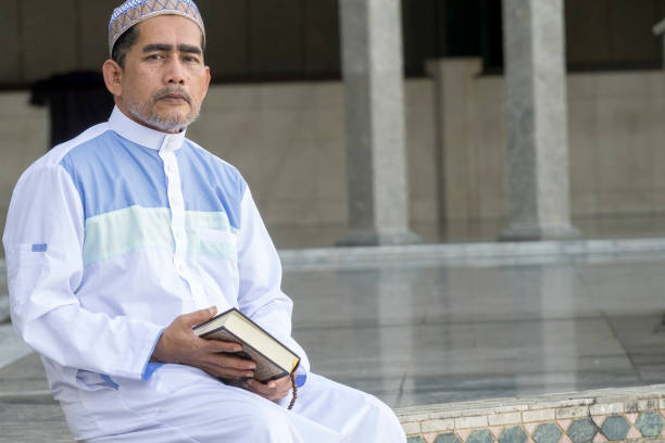 istock Portrait Of Man Sitting At Mosque 1134729898