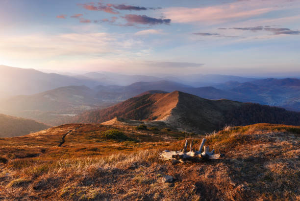 istock Scenic view of mountains with colorful hills at sunset. Autumn landscape natural background. 1134730131