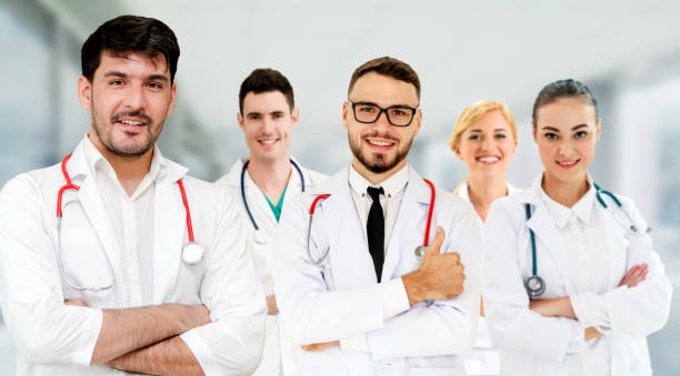 istock Healthcare people group. Professional doctor working in hospital office or clinic with other doctors, nurse and surgeon. Medical technology research institute and doctor staff service concept. 1134731493