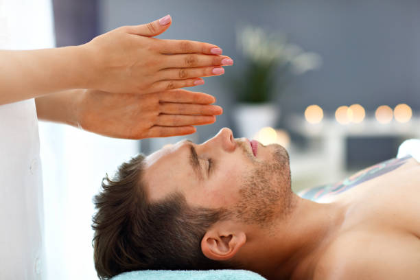 istock Handsome man having massage in spa salon 1134741354