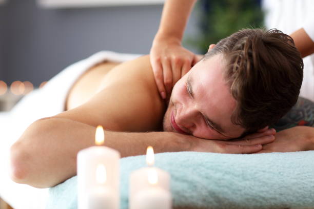 istock Handsome man having massage in spa salon 1134741409