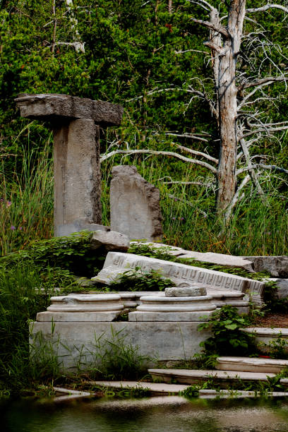 istock scary dark place of a graveyard with stone structures and green grass 1134747913
