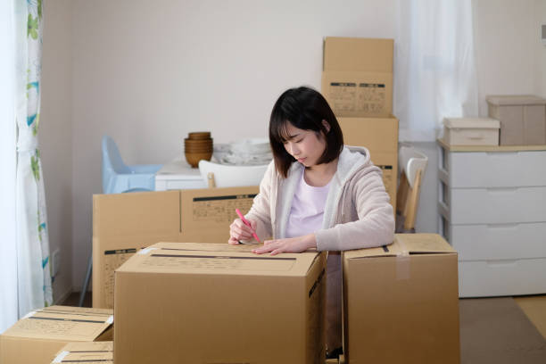 istock Woman preparing for moving house 1134749040